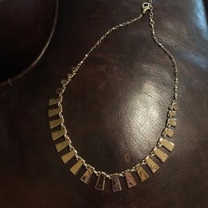 Well crafted gold colored necklace.